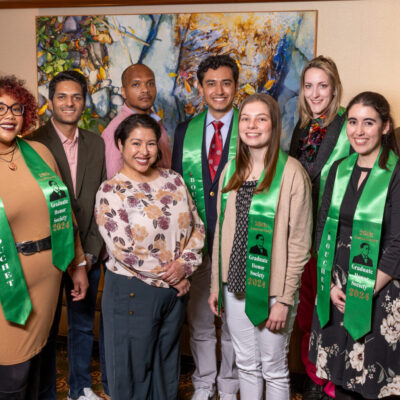 Image of nine new Bouchet Scholars, half of whom have on green stoles
